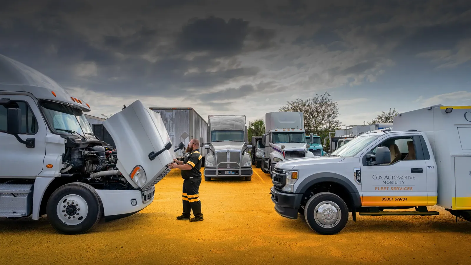 DIAL Lubricants fleet service trucks being maintained on site